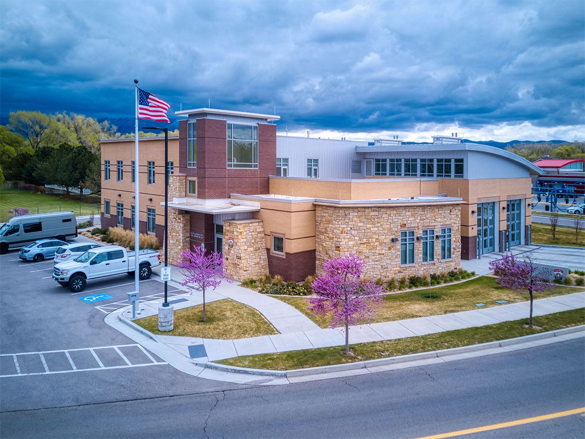 Fire Station 63 in the spring with pink blossoms in the trees.