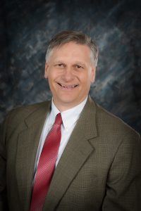 Brian Preece, economic development director, smiling.